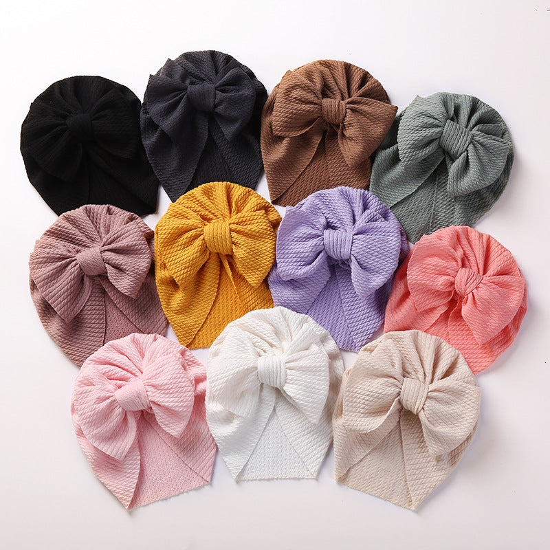 Cozy Pit-Strip Baby Beanie with Bows